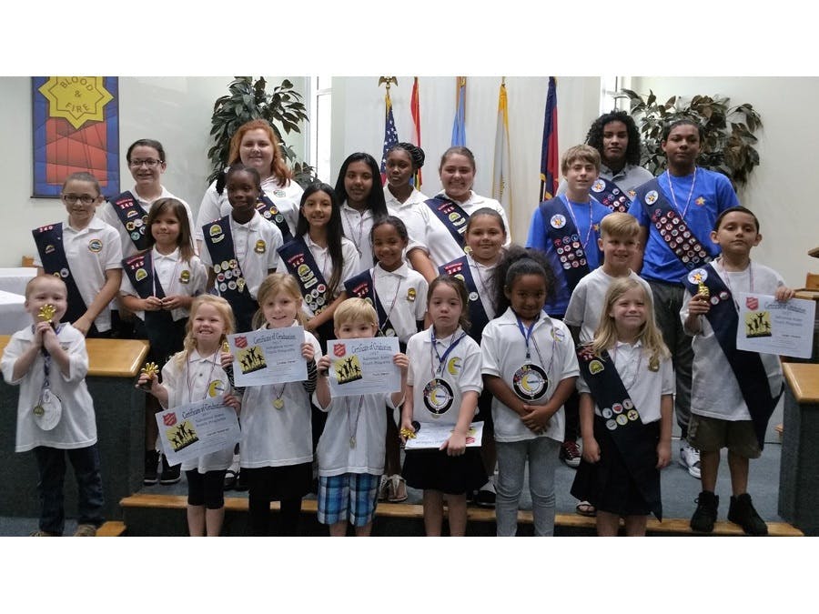 children posing on stage